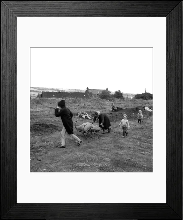 Framed Print : The people of Craghead in County Durham are taking the chance of a bit of free coal by