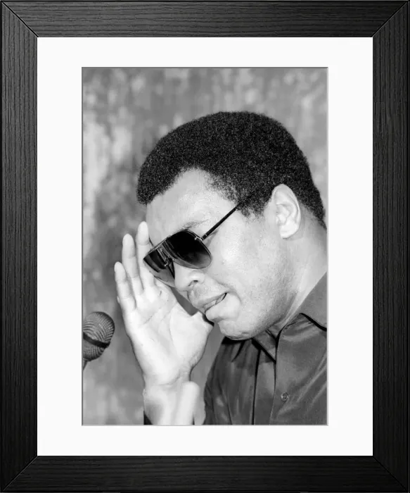 Framed Print : Muhammad Ali seen here at the post fight press conference following his lost to Larry Framed Print : Muhammad Ali seen here at the post fight press conference following his lost to Larry