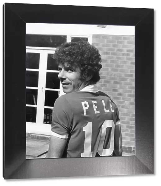 Charlie Aitken wearing a Pele football shirt. 25th May 1977
