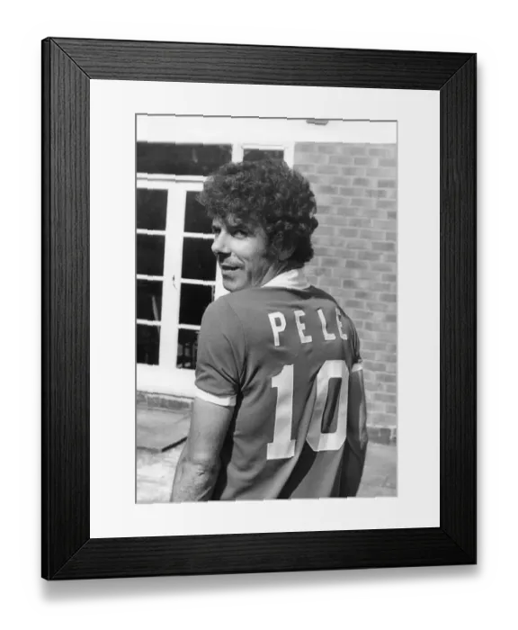 Framed Print : Charlie Aitken wearing a Pele football shirt. 25th May 1977