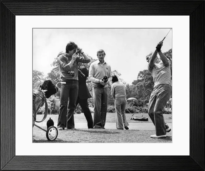 Framed Print : Aston Villa footballer Dennis Mortimer takes a photograph of manager Ron Saunders Framed Print : Aston Villa footballer Dennis Mortimer takes a photograph of manager Ron Saunders
