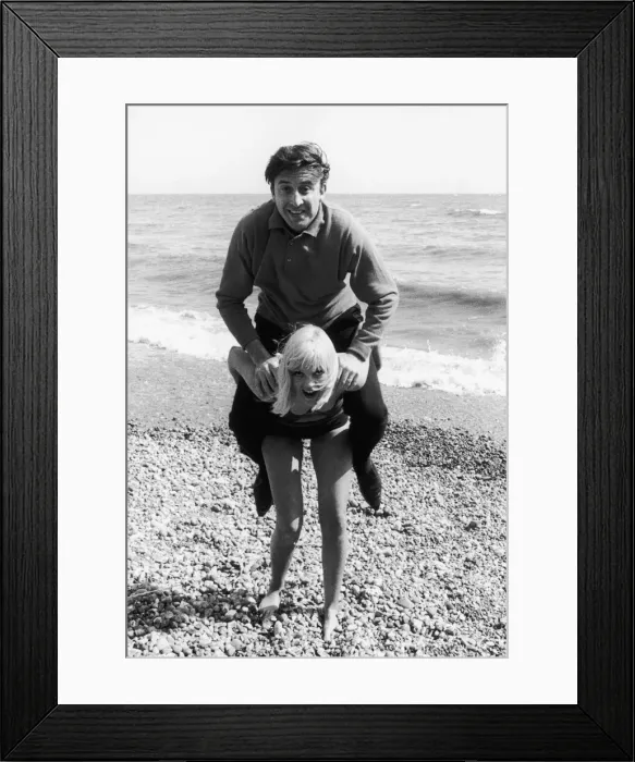 Framed Print : Singer Vince Hill seen here playing on the beach at Brighton with TV presenter Anne Framed Print : Singer Vince Hill seen here playing on the beach at Brighton with TV presenter Anne