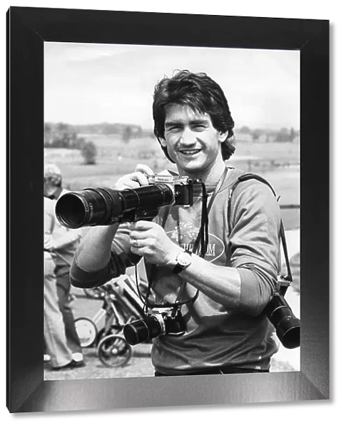 Dennis Mortimer, Aston Villa captain when they won the European Cup. Holding a camera