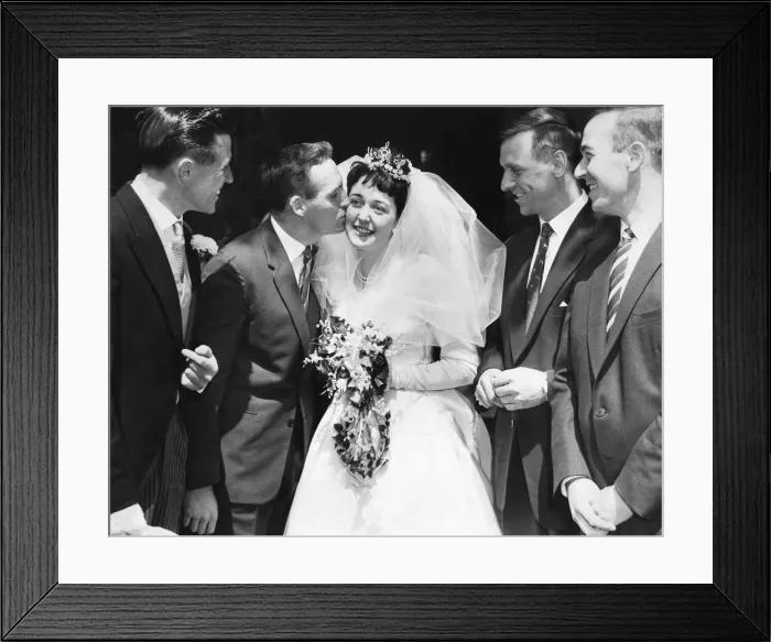 Framed Print : Johnny Dixon, Aston Villas long-service player, kisses his bride, Miss Brenda Fisher Framed Print : Johnny Dixon, Aston Villas long-service player, kisses his bride, Miss Brenda Fisher