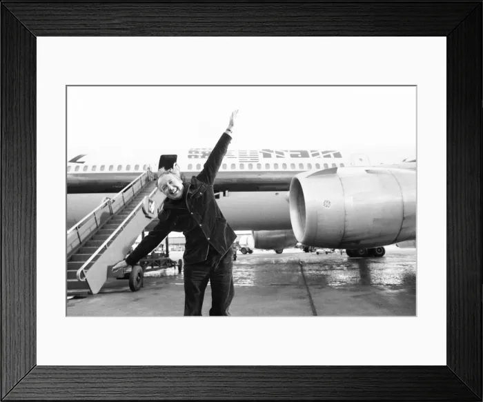 Framed Print : Head of Laker Airways Freddie Laker in jubilant mood on the runway at Gatwick airport