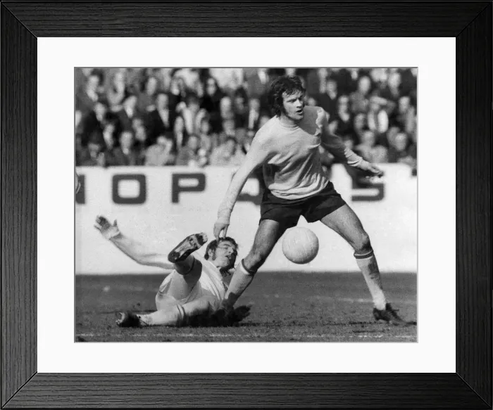 Framed Print : Arsenal v. Stoke. Arsenals hero Peter Storey is tacked by Stoke defender