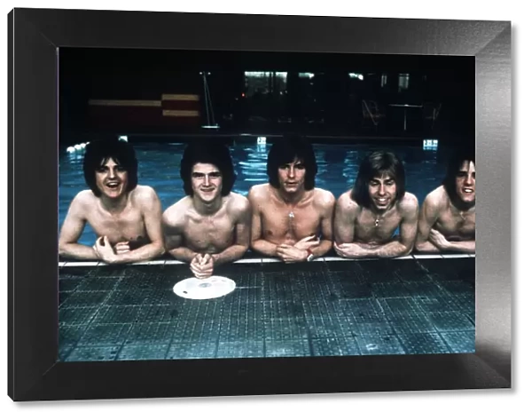 Pop group The Bay City Rollers pose in the swimming pool. 11th March 1975