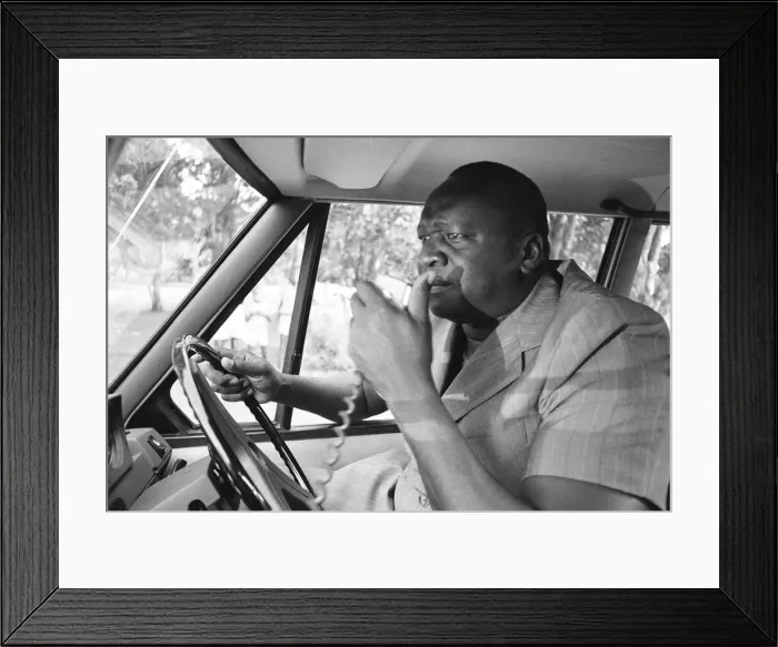 Framed Print : President Idi Amin at the wheel of his Range Rover at Entebbe Airport near Kampala Framed Print : President Idi Amin at the wheel of his Range Rover at Entebbe Airport near Kampala