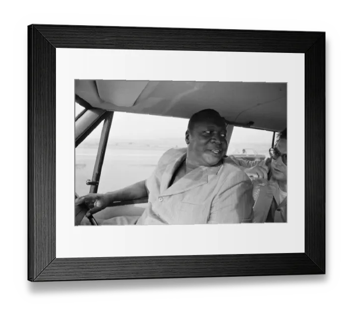 Framed Print : President Idi Amin at the wheel of his Range Rover at Entebbe Airport near Kampala Framed Print : President Idi Amin at the wheel of his Range Rover at Entebbe Airport near Kampala