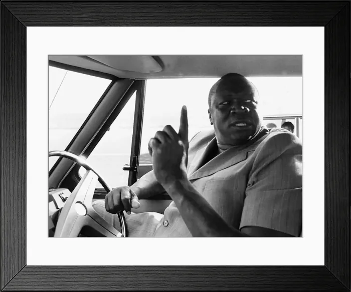 Framed Print : President Idi Amin at the wheel of his Range Rover at Entebbe Airport near Kampala