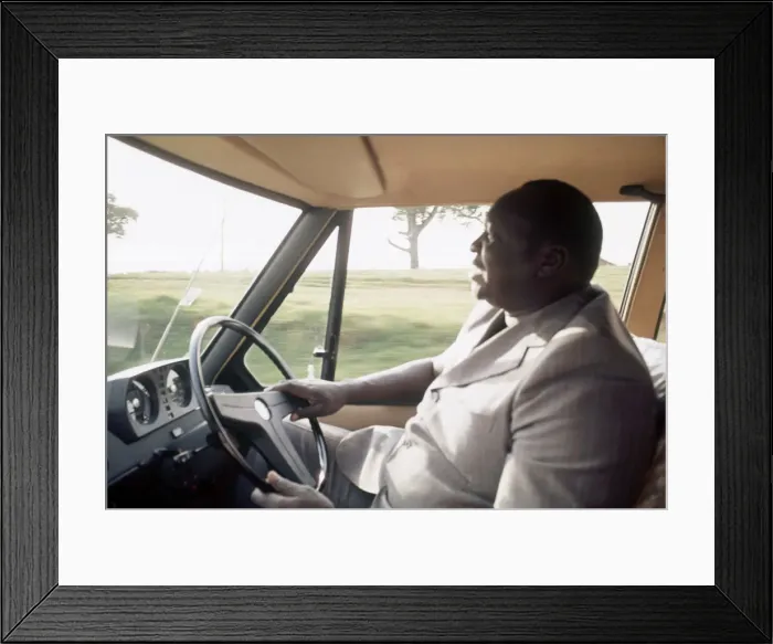 Framed Print : President of Uganda, General Idi Amin, pictured at the wheel of his Range Rover Framed Print : President of Uganda, General Idi Amin, pictured at the wheel of his Range Rover