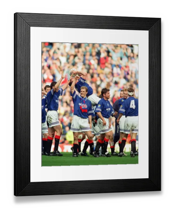 Framed Print : Glasgow Rangers footballer Paul Gascoigne kisses the match ball as he celebrates Rangers
