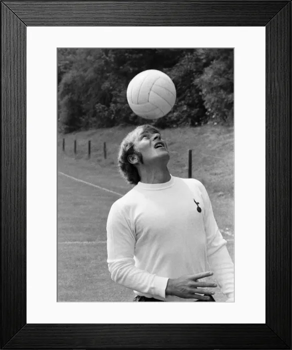 Framed Print : Tottenham Hotspur footballer Ralph Coates practices his heading skills during the Spurs Framed Print : Tottenham Hotspur footballer Ralph Coates practices his heading skills during the Spurs