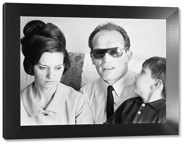 Boxer Henry Cooper seen here with his wife Albina and son following losing his fight with