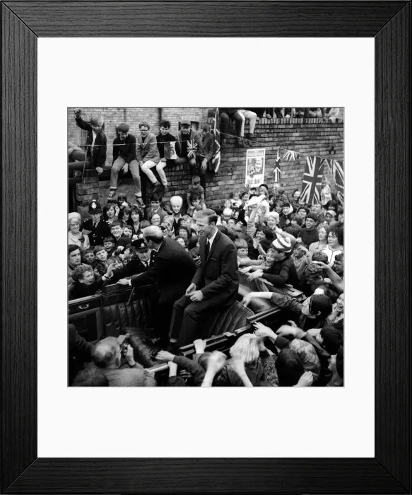 Framed Print : Jack and Bobby Charlton look over-awed as youngsters crowd around the car taking them to Framed Print : Jack and Bobby Charlton look over-awed as youngsters crowd around the car taking them to