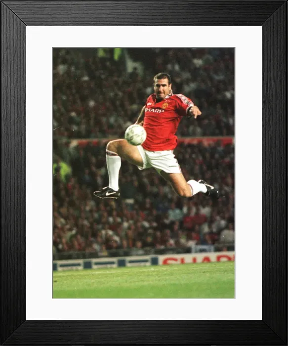 Framed Print : Eric Cantona jumping to control a ball Aug 1998 Framed Print : Eric Cantona jumping to control a ball Aug 1998