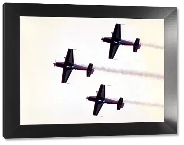 Aircraft from aerobatic display team perform at an airshow