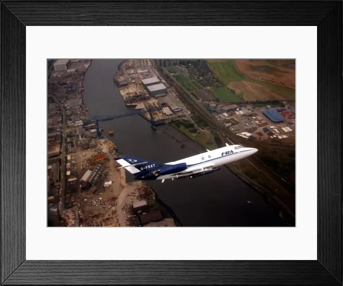Framed Print : A Dassault Falcon 20 aircraft over the River Tees and the Transporter Bridge in Framed Print : A Dassault Falcon 20 aircraft over the River Tees and the Transporter Bridge in