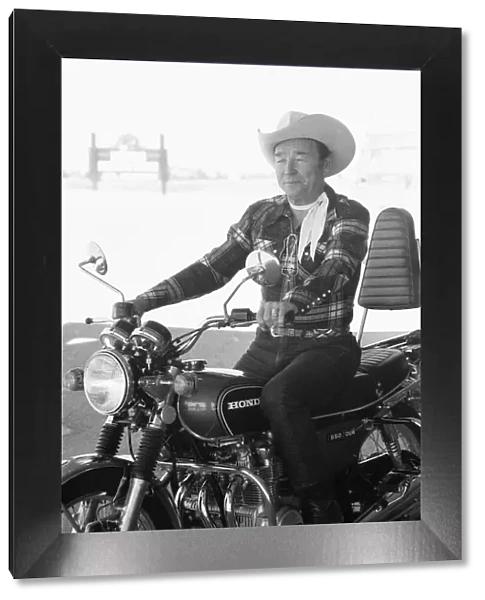 Actor Roy Rogers known as the singing cowboy seen here on a Honda motorbike instead of
