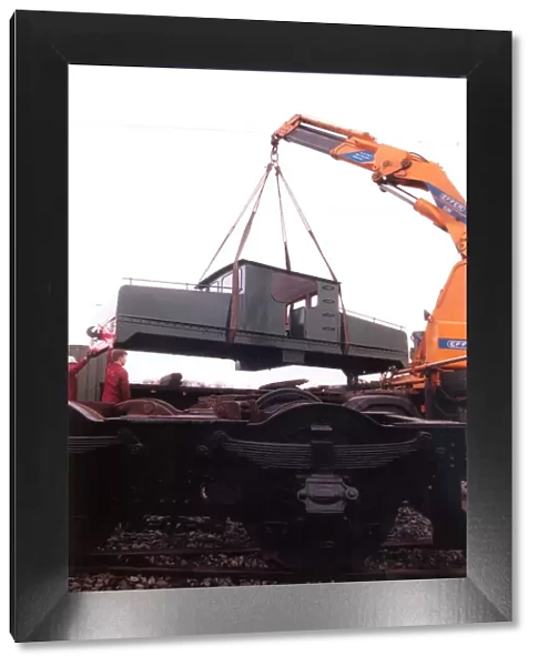 A lottery grant facelift begins for the 1909 Siemens locomotive as its is lifted on to a
