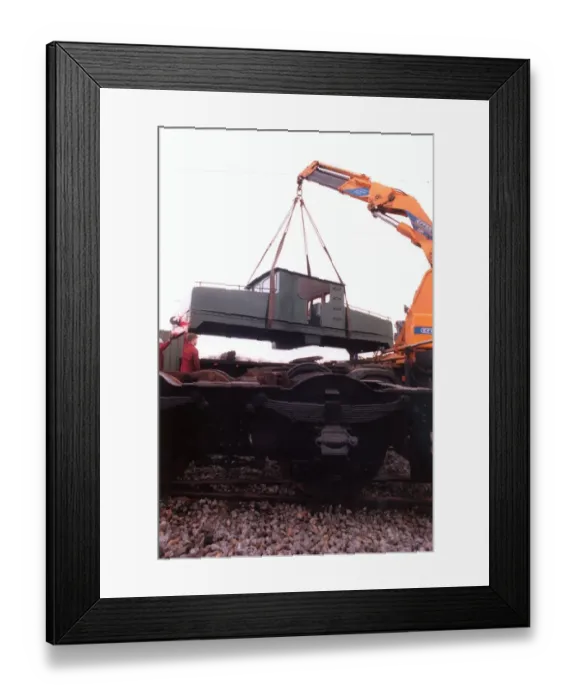 Framed Print : A lottery grant facelift begins for the 1909 Siemens locomotive as its is lifted on to a Framed Print : A lottery grant facelift begins for the 1909 Siemens locomotive as its is lifted on to a