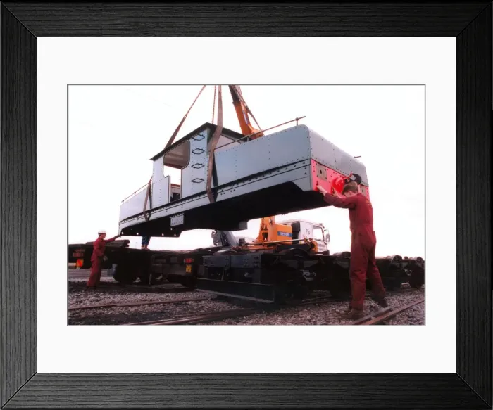 Framed Print : A lottery grant facelift begins for the 1909 Siemens locomotive as its is lifted on to a Framed Print : A lottery grant facelift begins for the 1909 Siemens locomotive as its is lifted on to a