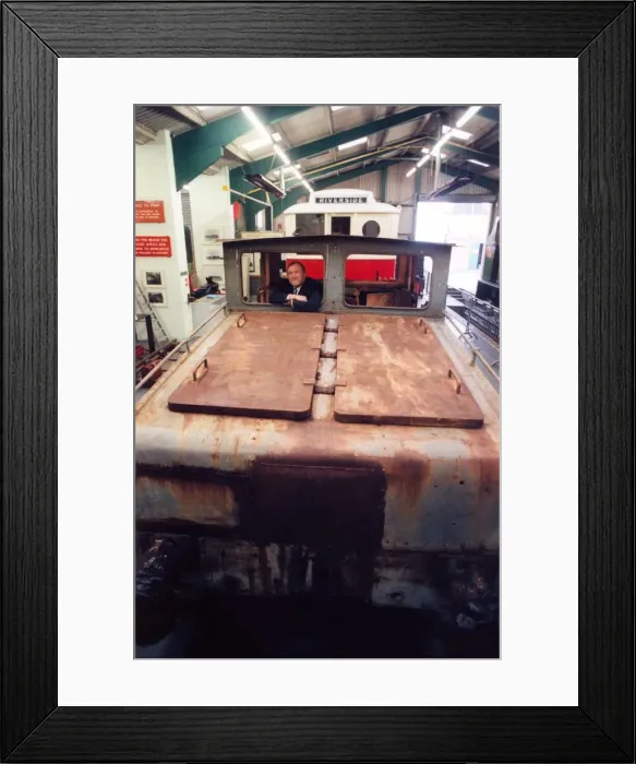 Framed Print : Lou Avis of Siemens Electronics takes a look at the 1909 Siemens engine being restored