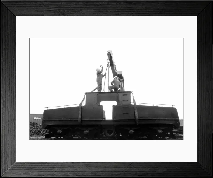 Framed Print : A lottery grant facelift begins for the 1909 Siemens locomotive as its is lifted on to a