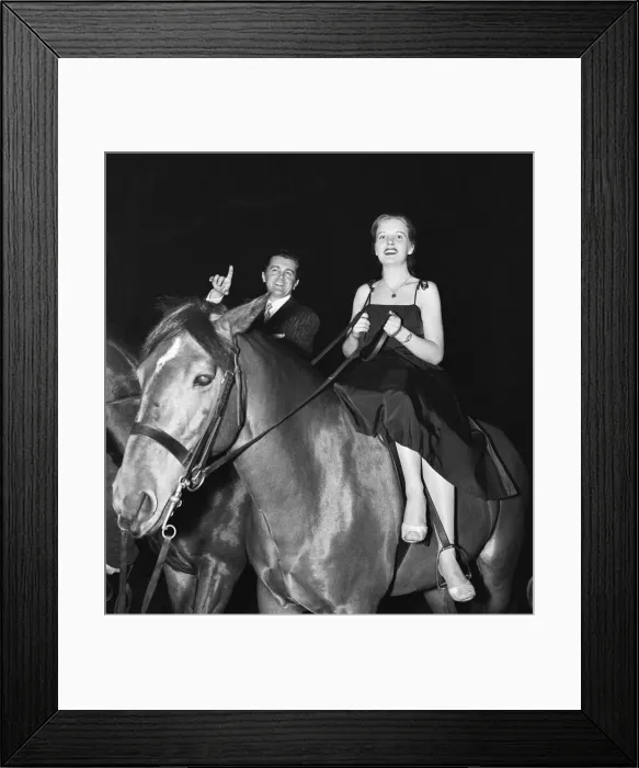 Framed Print : British musician Ronnie Ronalde and Bride Corsie on horseback Framed Print : British musician Ronnie Ronalde and Bride Corsie on horseback