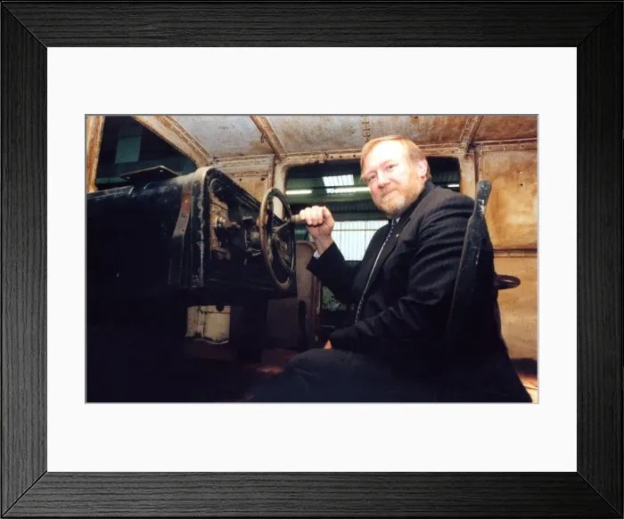 Framed Print : Lou Avis of Siemens Electronics takes a look at the 1909 Siemens engine being restored Framed Print : Lou Avis of Siemens Electronics takes a look at the 1909 Siemens engine being restored