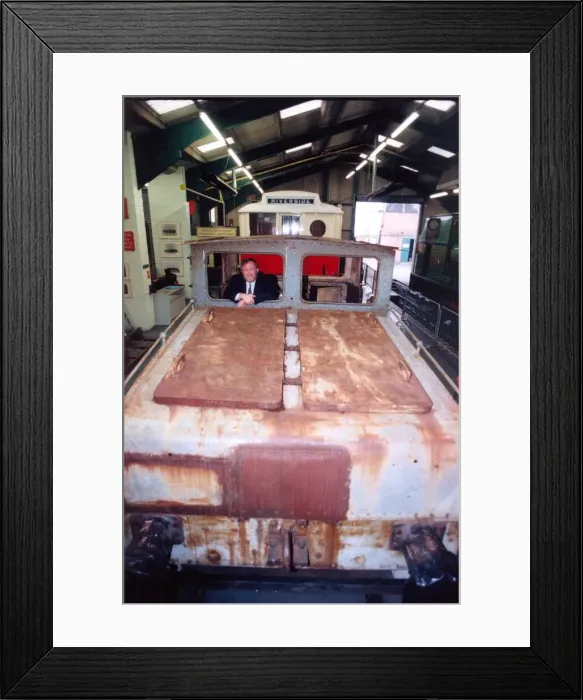 Framed Print : Lou Avis of Siemens Electronics takes a look at the 1909 Siemens engine being restored
