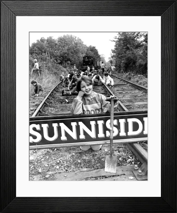Framed Print : Alison Ashby, nine, and fellow pupils from Marley Hill School are helping to clean up