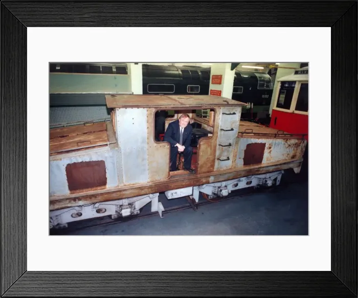 Framed Print : Lou Avis of Siemens Electronics takes a look at the 1909 Siemens engine being restored