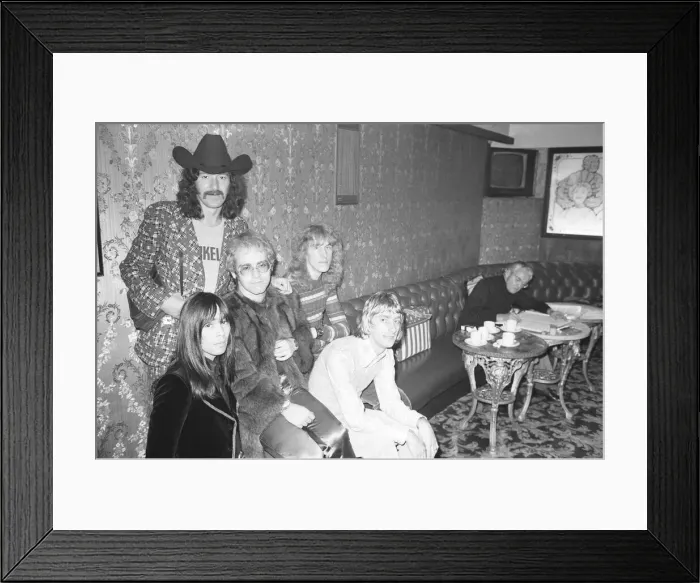Framed Print : Elton John and his group pose for pictures in the Palladium bar during rehearsals for Framed Print : Elton John and his group pose for pictures in the Palladium bar during rehearsals for