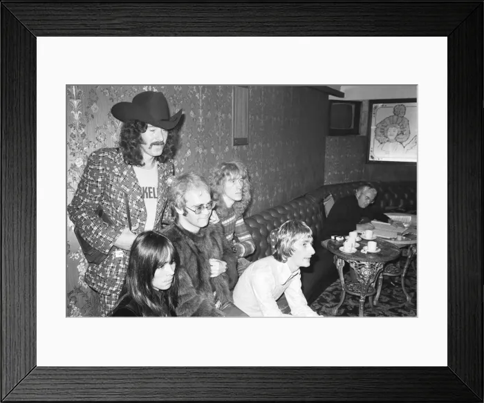 Framed Print : Elton John and his group pose for pictures in the Palladium bar during rehearsals for Framed Print : Elton John and his group pose for pictures in the Palladium bar during rehearsals for