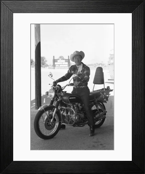 Framed Print : Actor Roy Rogers known as the singing cowboy seen here on a Honda motorbike instead of