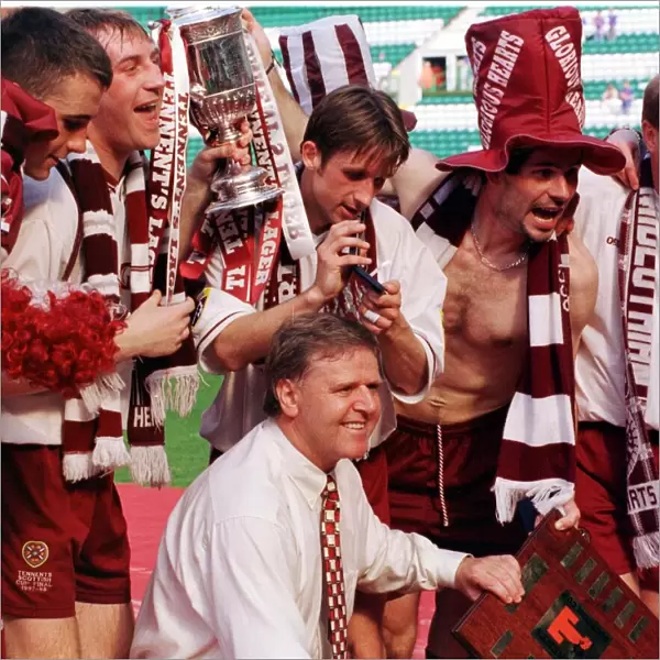 Heart of Midlothian manager Jim Jefferies and players celebrate with the Scottish Cup