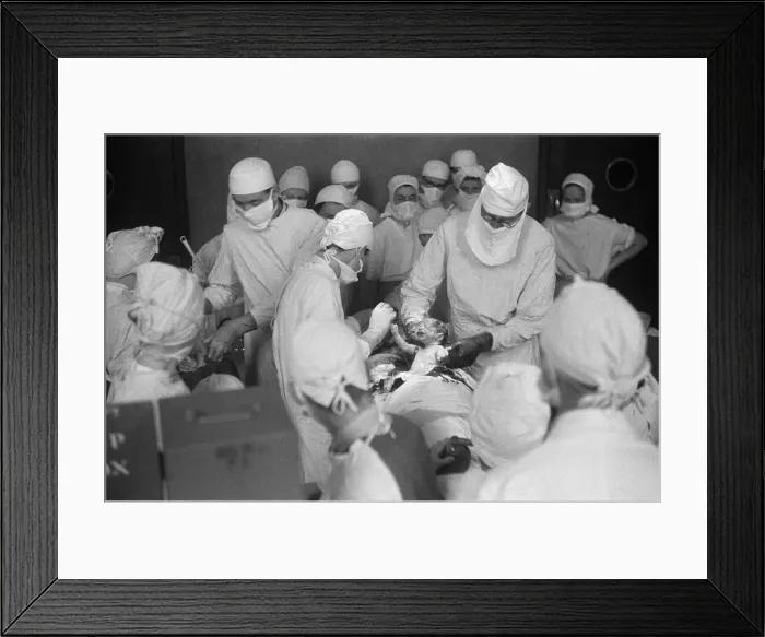 Framed Print : Surgeon professor Browne seen here performing a caesarian section operation to deliver
