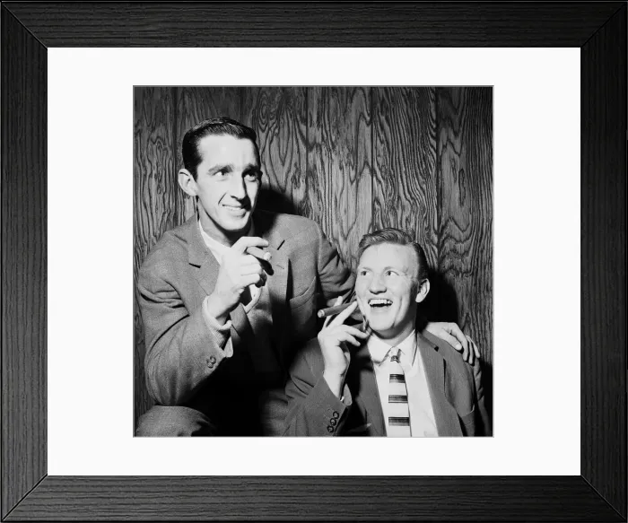 Framed Print : Everton football players Roy Vernon and Jimmy Gabriel smoking cigars as they celebrate Framed Print : Everton football players Roy Vernon and Jimmy Gabriel smoking cigars as they celebrate