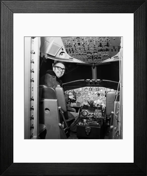 Framed Print : British airline entrepreneur Freddie Laker pictured in the cockpit of one of his planes