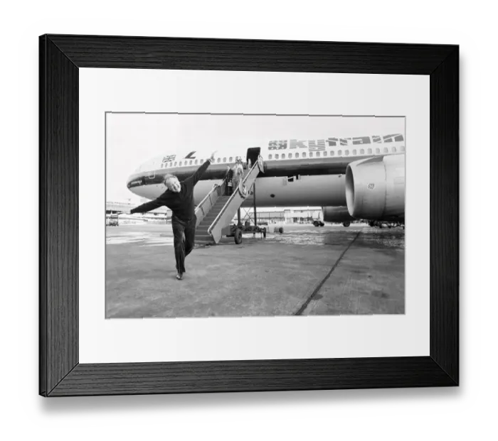 Framed Print : Head of Laker Airways Freddie Laker in jubilant mood on the runway at Gatwick airport Framed Print : Head of Laker Airways Freddie Laker in jubilant mood on the runway at Gatwick airport