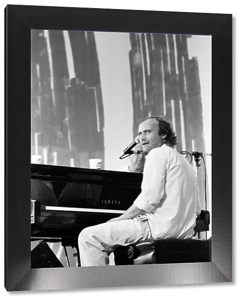 Phil Collins perforing at the Live Aid concert in Philadelphia, USA. 13th July 1985
