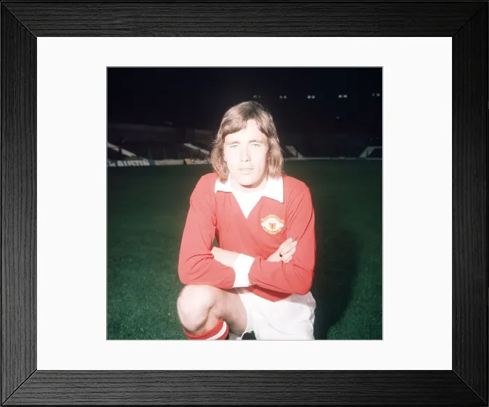 Framed Print : Manchester United footballer Sammy McIlroy poses during a pre season photocall at Old