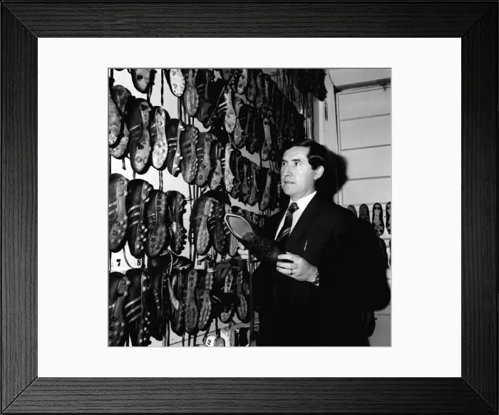 Framed Print : Manchester United manager Frank O Farrell inspects the teams boots in the boot room