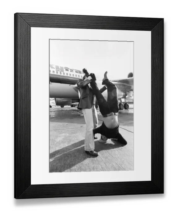 Framed Print : Head of Laker Airways Freddie Laker in jubilant mood on the runway at Gatwick airport
