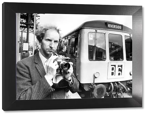 Mr. Graham Hague from Sheffield who is a railway enthusiast taking pictures of a Diesel