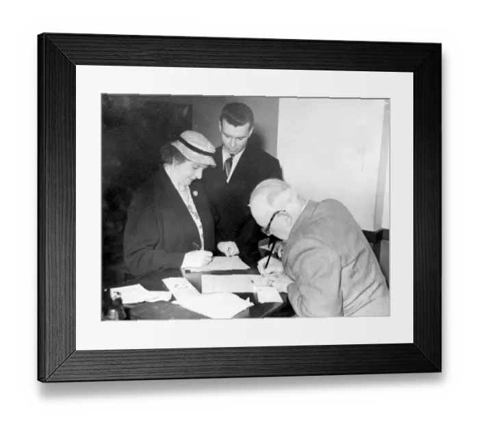 Framed Print : Welsh Athlete Hywel Williams watches as his widowed mother Mrs Olwen Williams pay for his