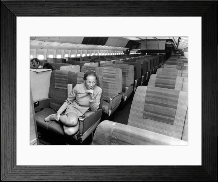 Framed Print : Stewardess Jane Ridley sits in the huge cabin of a Lockheed Tri-Star airliner named Framed Print : Stewardess Jane Ridley sits in the huge cabin of a Lockheed Tri-Star airliner named