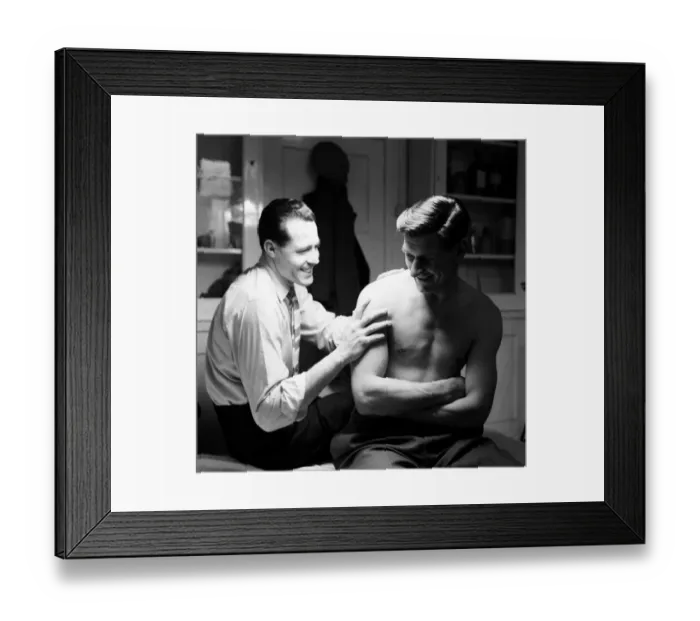 Framed Print : Norwich City FC players in dressing room. Injured keeper Ken Nethercott has his