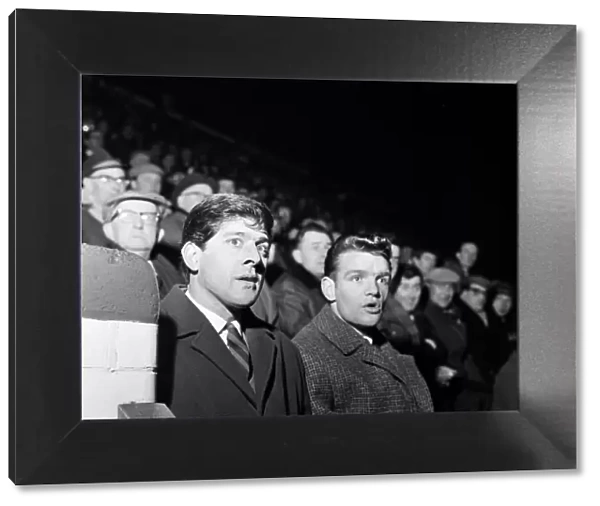 Norwich City FC players players Kevin Keelan and High Curran watching the game against